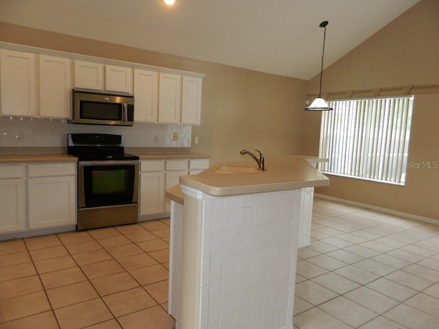 kitchen with sink, light tile patterned floors, appliances with stainless steel finishes, white cabinetry, and an island with sink