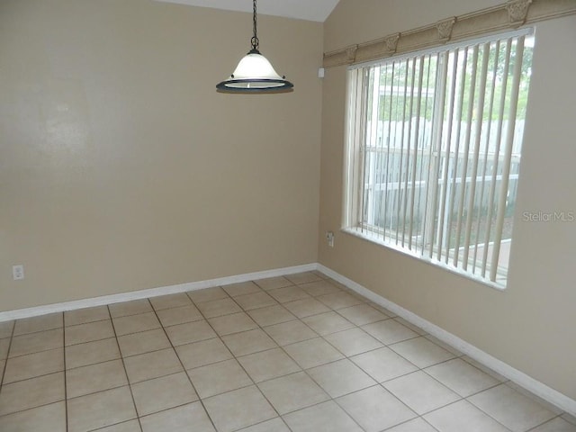 spare room with vaulted ceiling