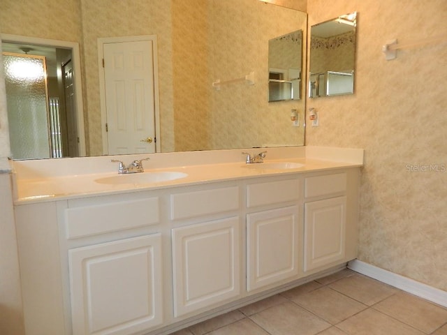 bathroom with tile patterned flooring and vanity