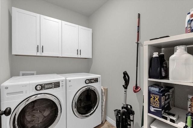 laundry room with cabinets and separate washer and dryer