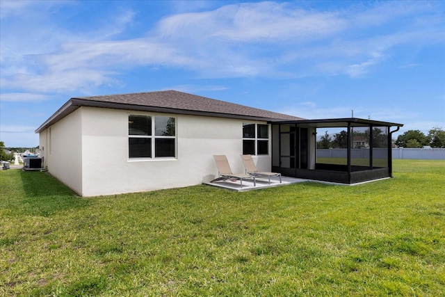 back of house featuring cooling unit, a lawn, a sunroom, and a patio