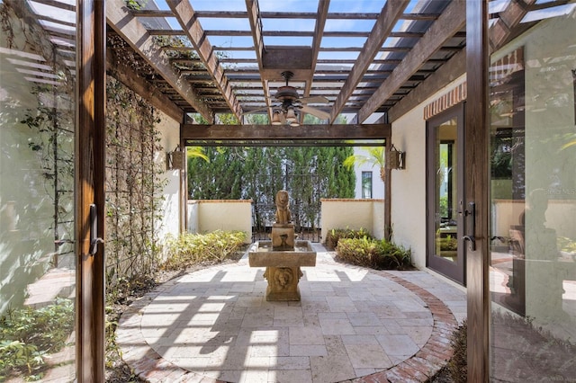 view of patio / terrace featuring a pergola, french doors, and ceiling fan