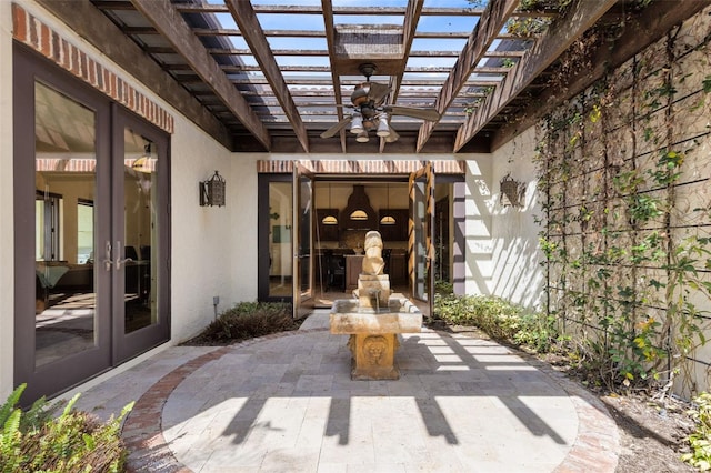 view of patio with a pergola, ceiling fan, and french doors