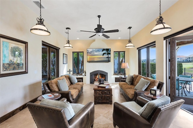 living room featuring french doors and ceiling fan