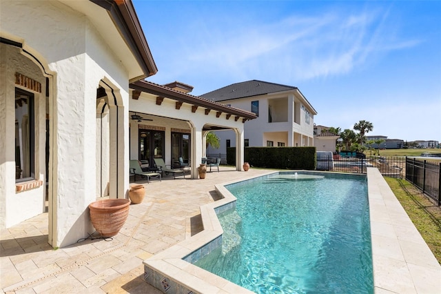 view of swimming pool with a patio area