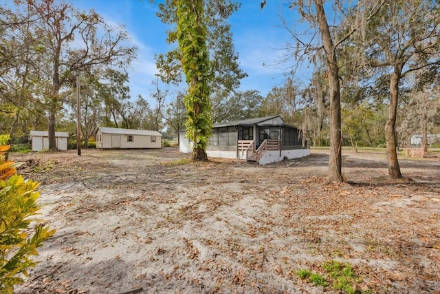 view of yard with a sunroom