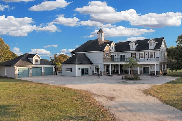 view of front of property featuring a garage and a front yard