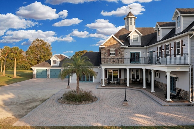 exterior space with a garage and a balcony