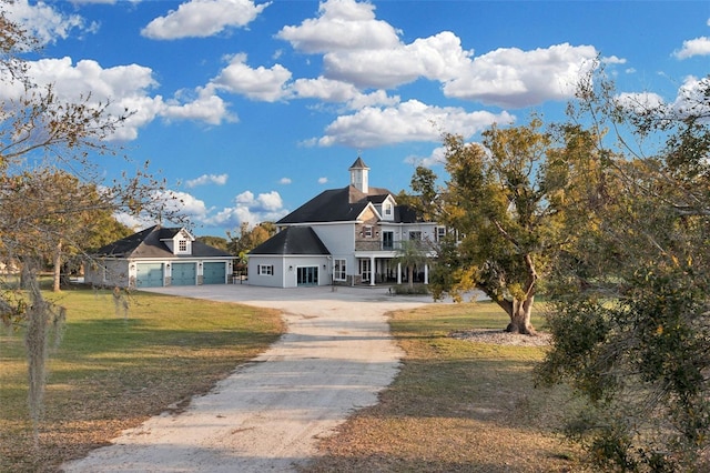 view of front of home with a garage and a front yard