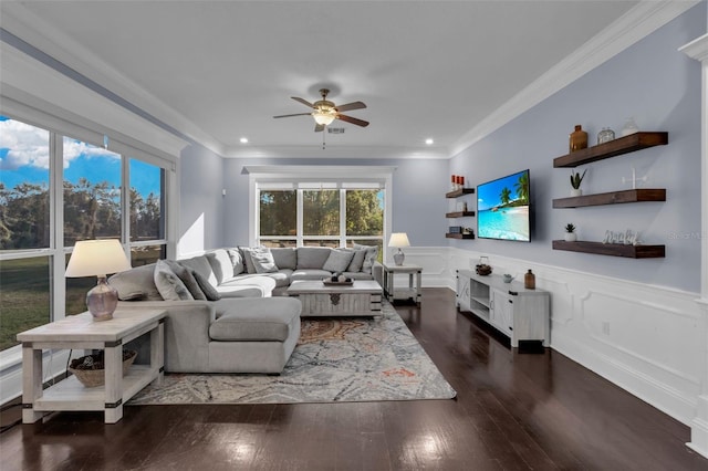 living room with crown molding, ceiling fan, and dark hardwood / wood-style flooring