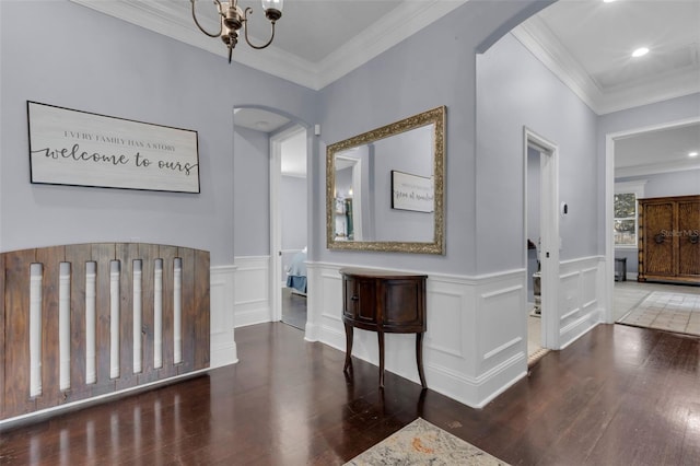 bedroom with ornamental molding, dark hardwood / wood-style floors, and a chandelier