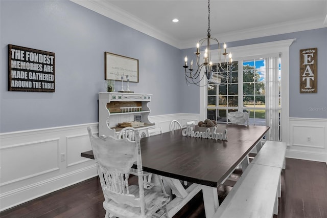 dining room with crown molding, dark hardwood / wood-style flooring, and a notable chandelier