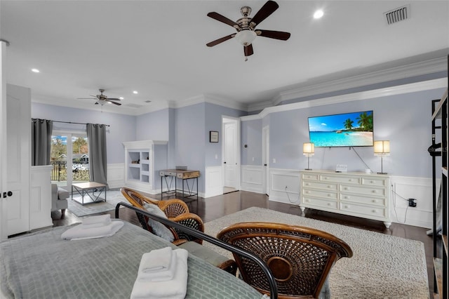 bedroom featuring hardwood / wood-style flooring, ceiling fan, and ornamental molding