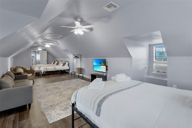 bedroom with dark wood-type flooring, ceiling fan, and lofted ceiling