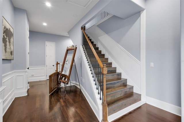 staircase featuring hardwood / wood-style flooring