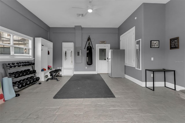 interior space featuring ceiling fan and stainless steel refrigerator