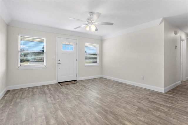 entryway with ceiling fan and light hardwood / wood-style flooring