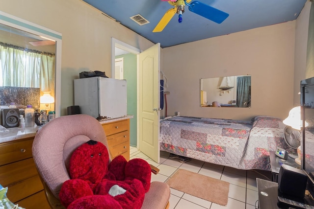 tiled bedroom with ceiling fan