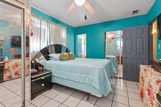 bedroom with ceiling fan and light tile patterned floors