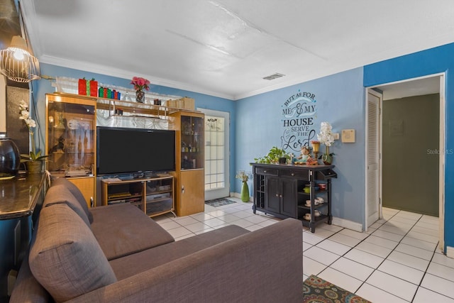 living room featuring ornamental molding and light tile patterned floors