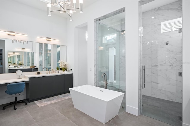 bathroom with plus walk in shower, plenty of natural light, and vanity