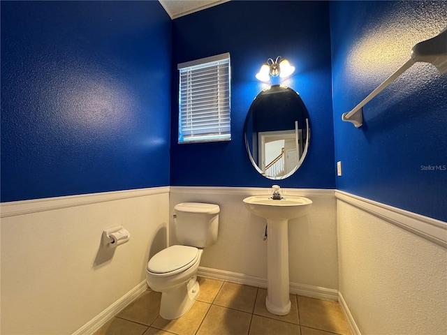 bathroom featuring tile patterned floors and toilet