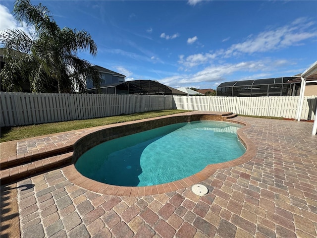 view of pool featuring a lanai and a patio area