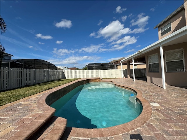 view of swimming pool featuring a patio area