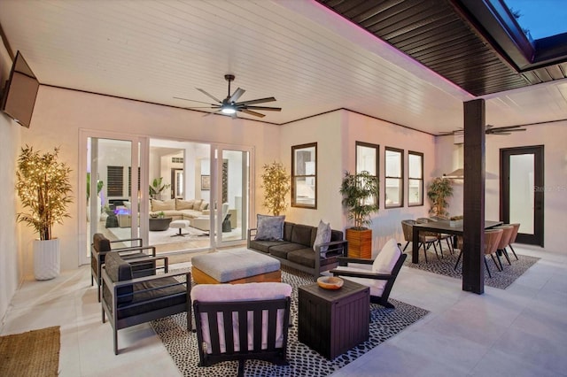 view of patio / terrace with an outdoor living space and ceiling fan