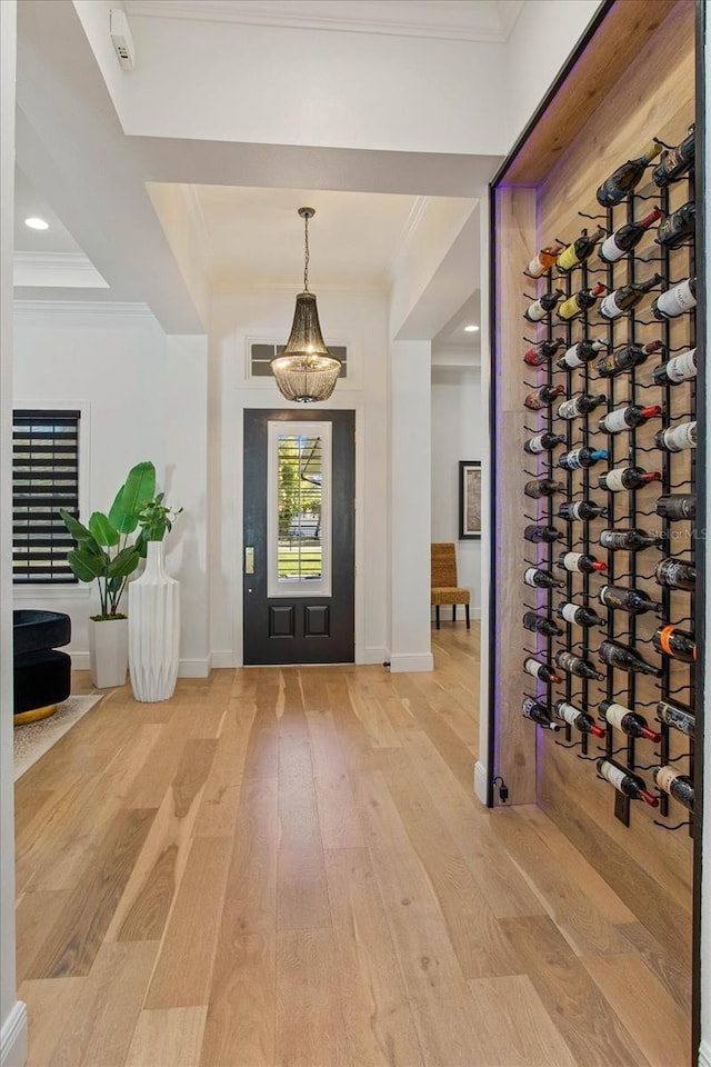 interior space featuring hardwood / wood-style floors and crown molding