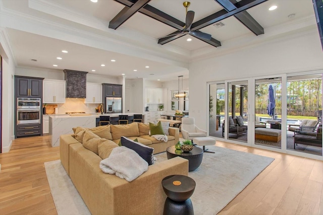 living room with coffered ceiling, beam ceiling, and light hardwood / wood-style floors