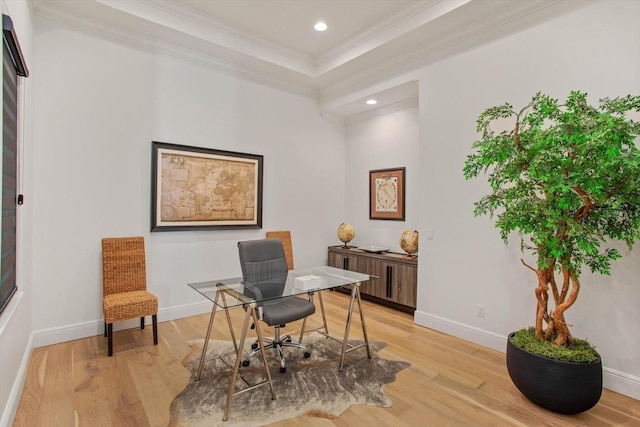 home office featuring ornamental molding and light wood-type flooring