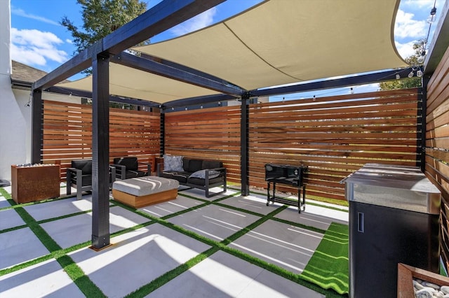 view of patio featuring an outdoor hangout area and a pergola