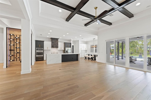 10416 Pocket Ln, Orlando, FL 32836 - unfurnished living room featuring coffered ceiling, ornamental molding, beamed ceiling, a ceiling fan, and light wood-style flooring