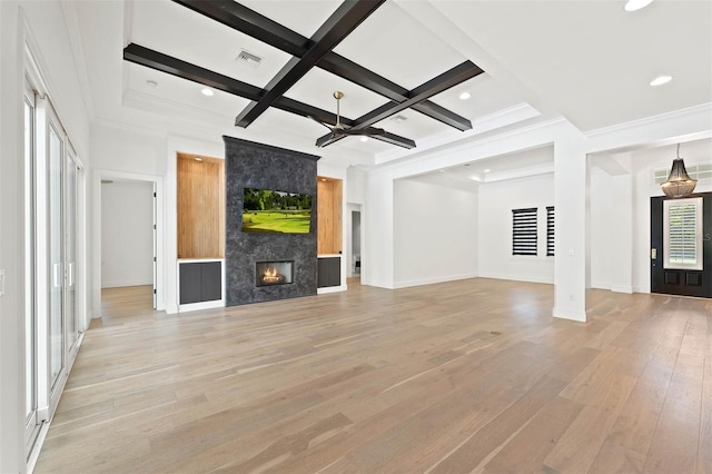 10416 Pocket Ln, Orlando, FL 32836 - unfurnished living room featuring light wood-type flooring, beam ceiling, coffered ceiling, a fireplace, and recessed lighting
