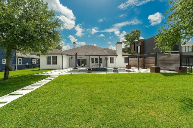 10416 Pocket Ln, Orlando, FL 32836 - rear view of house featuring a patio area, a swimming pool, stucco siding, and a chimney