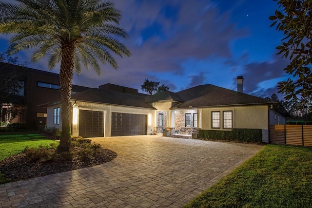 10416 Pocket Ln, Orlando, FL 32836 - view of front of home with stucco siding, a garage, and decorative driveway