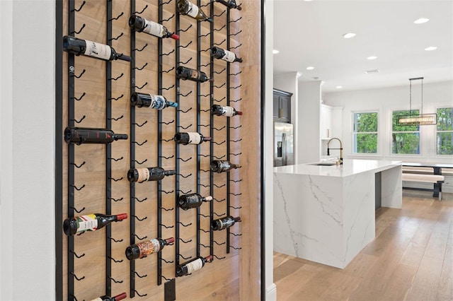 10416 Pocket Ln, Orlando, FL 32836 - wine cellar featuring light wood-type flooring and recessed lighting