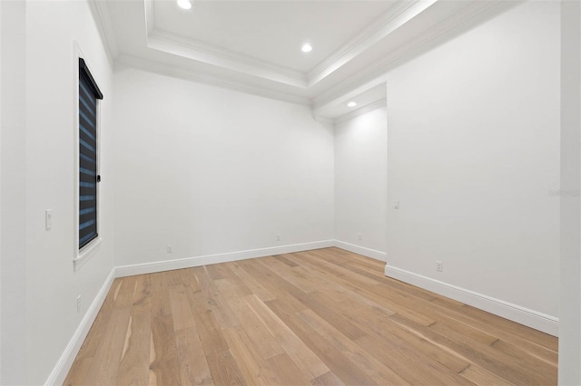10416 Pocket Ln, Orlando, FL 32836 - spare room with crown molding, light wood-type flooring, a raised ceiling, and recessed lighting