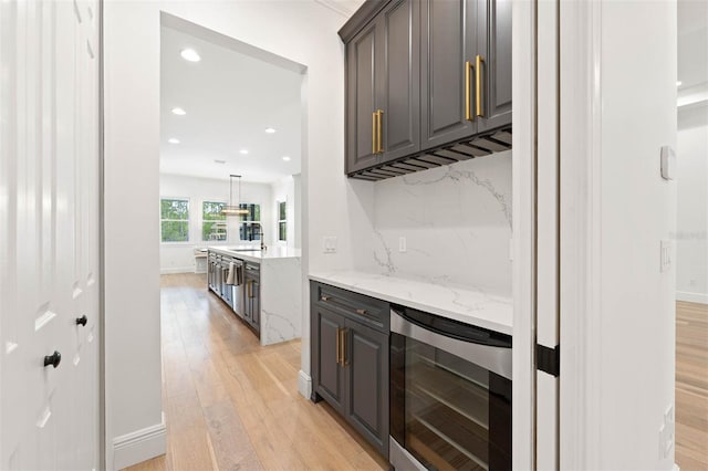 10416 Pocket Ln, Orlando, FL 32836 - bar featuring wine cooler, light wood-style floors, and recessed lighting
