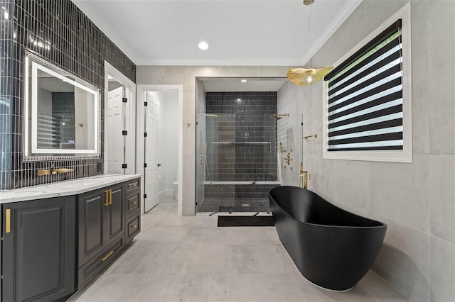 10416 Pocket Ln, Orlando, FL 32836 - full bathroom featuring ornamental molding, vanity, a stall shower, and a soaking tub
