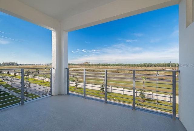 balcony featuring a rural view