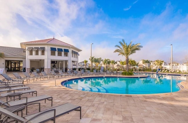 view of swimming pool featuring a patio