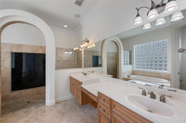 bathroom with crown molding, vanity, and separate shower and tub