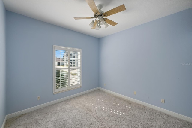 spare room with ceiling fan and carpet flooring