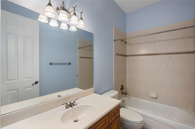 full bathroom featuring tiled shower / bath combo, vanity, a chandelier, and toilet