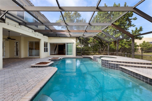 view of pool with an in ground hot tub, ceiling fan, and a patio area