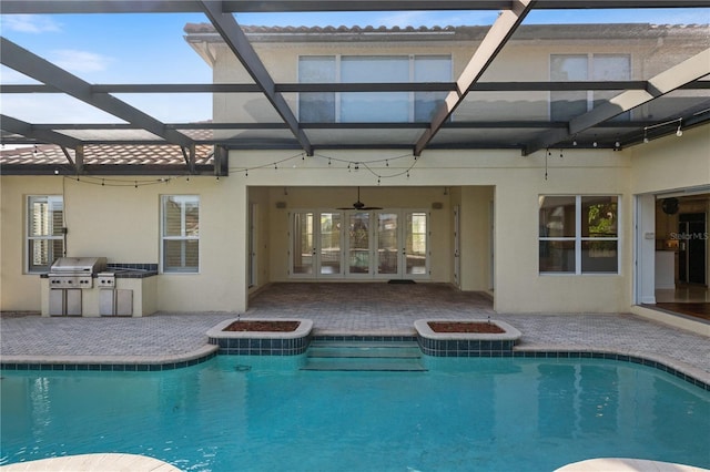 view of swimming pool featuring area for grilling and a patio area