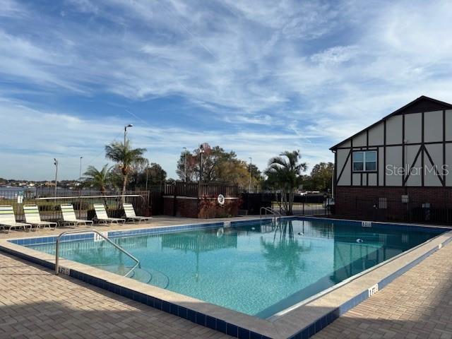 view of swimming pool with a patio area