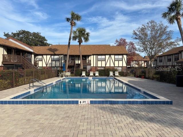 view of swimming pool with a patio area